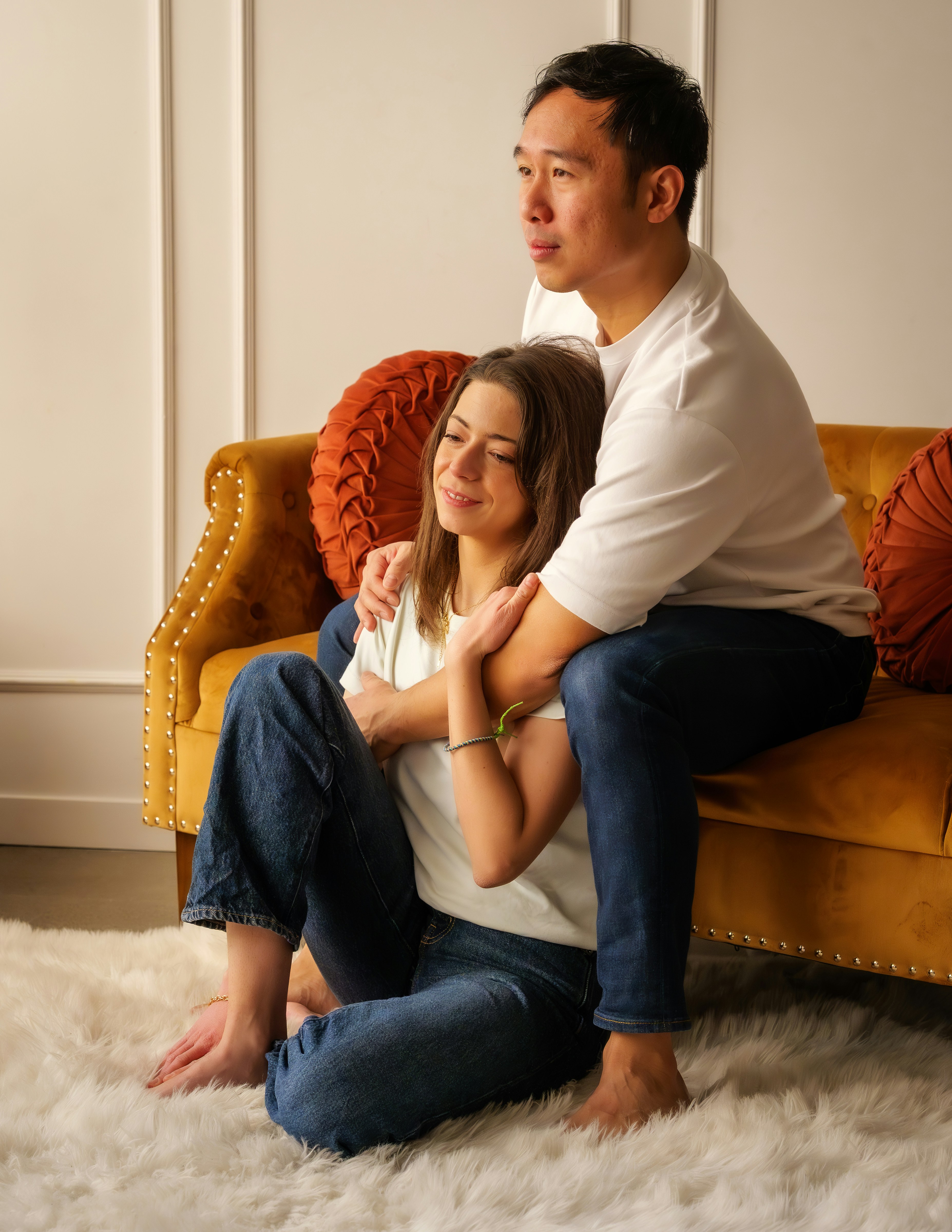 A parent sitting with and supporting their teenage child